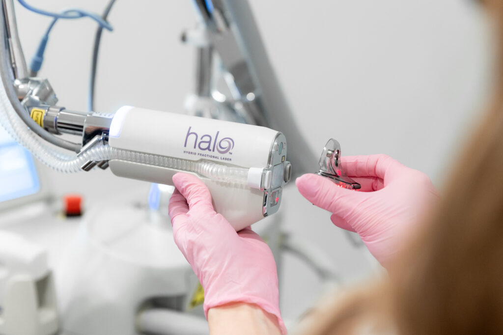 A Blush Aesthetics provider changes the HALO filter to customize a patient's hyperpigmentation treatment in Columbus.