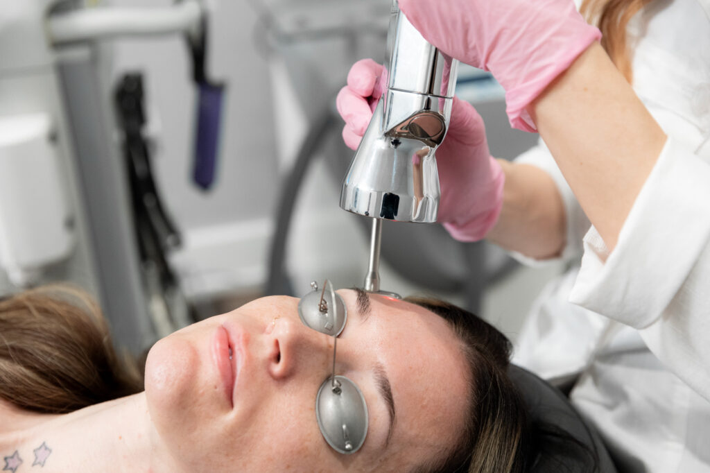A woman gets a treatment after learning about laser levels