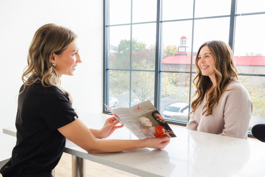 A female Blush Aesthetics provider discusses a patient's options for diVa vaginal rejuvenation at the best med spa in Columbus.